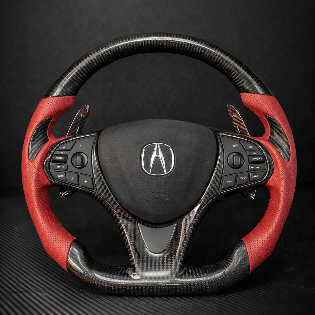 Red and black steering wheel with Acura logo on a dark background