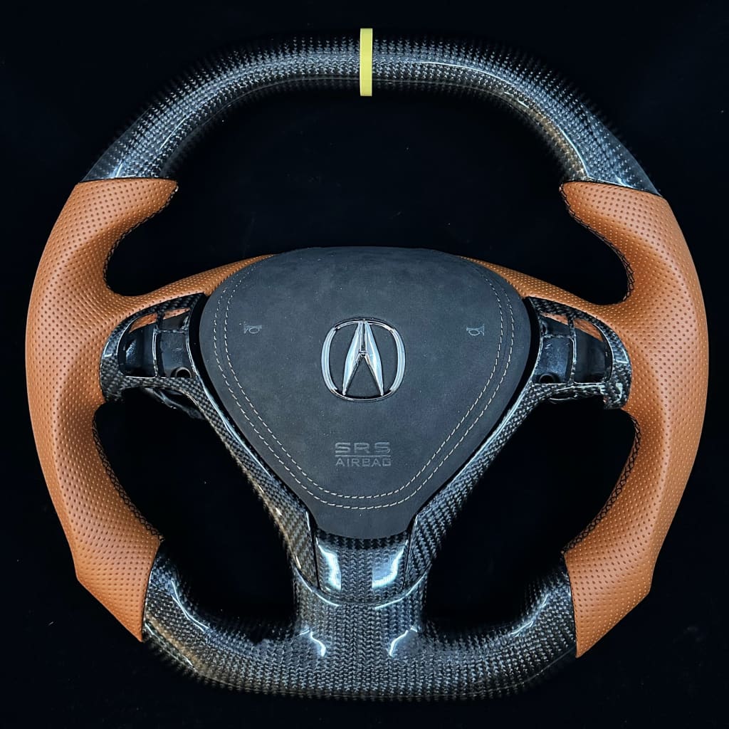 Steering wheel with Acura logo on a black background