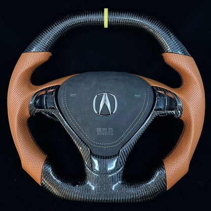 Steering wheel with Acura logo on a black background
