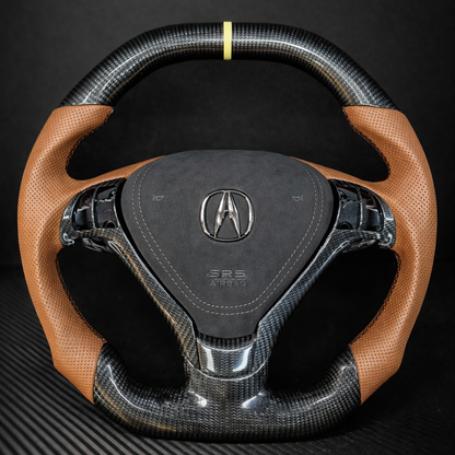 Carbon fiber steering wheel with brown leather accents on a black background
