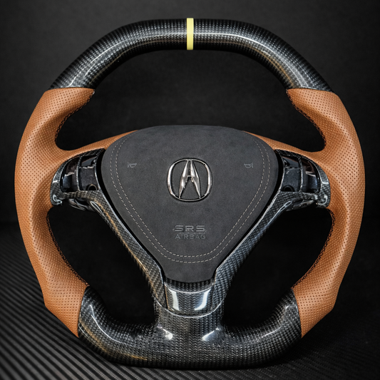 Carbon fiber steering wheel with brown leather accents on a black background