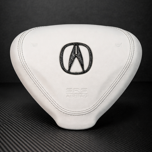 White car headrest with Acura logo on a black background