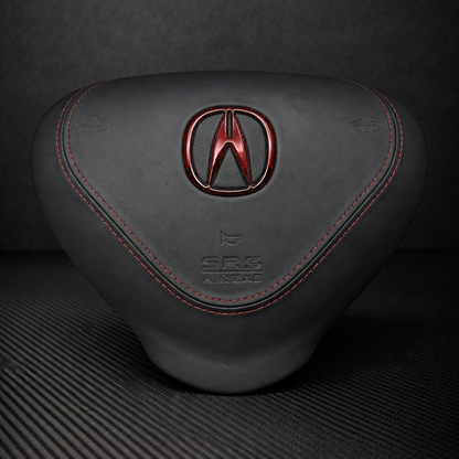 Black car headrest with Acura logo on a dark background