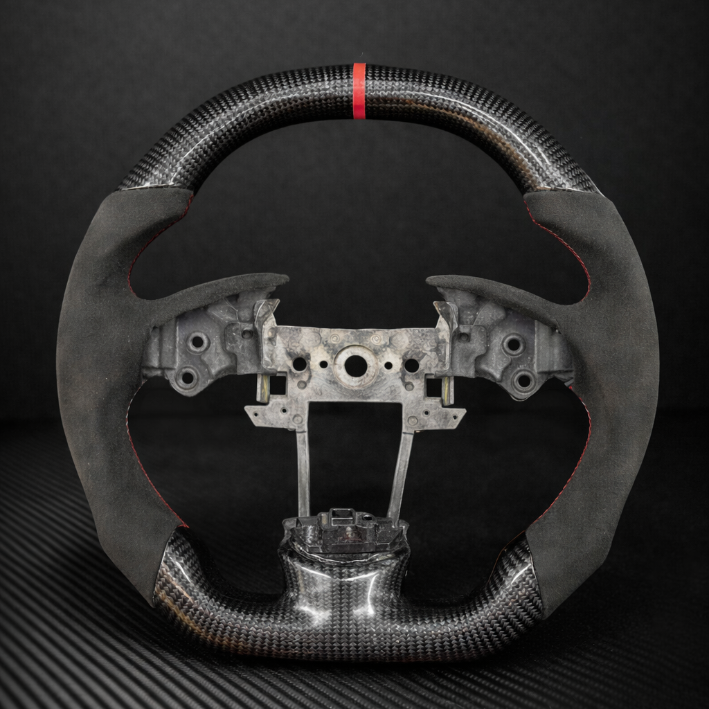 Carbon fiber steering wheel on a dark background